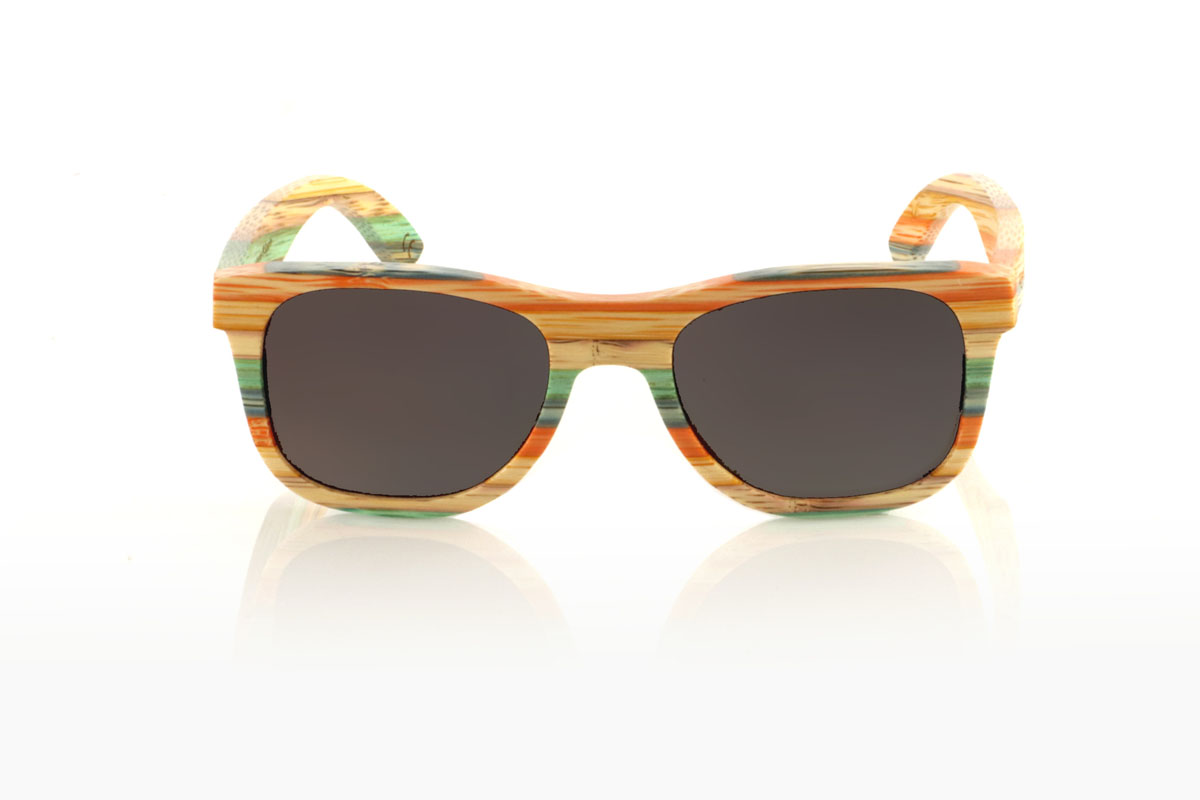 Wood eyewear of Bamboo KASHBAH. KASHBAH sunglasses, with a classic design and a slightly smaller size than the standard, make the difference in our bamboo collection. These glasses are made of vertically laminated bamboo wood, creating a pattern of soft colors that capture the light and the gaze of whoever sees them. The colorful result is not only visually attractive, but also adds a touch of originality and freshness to your style. With measurements of 143x46 and a caliber of 52, the KASHBAH are perfect for those looking for comfortable, light glasses with a unique touch that will not go unnoticed. for Wholesale & Retail | Root Sunglasses® 